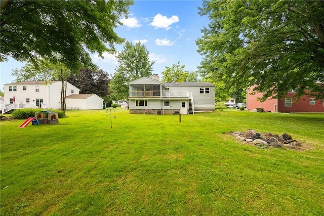 911 Copperkettle Rd, Webster, NY 14580 - back of property with a sunroom, a lawn, a fire pit, and a chimney