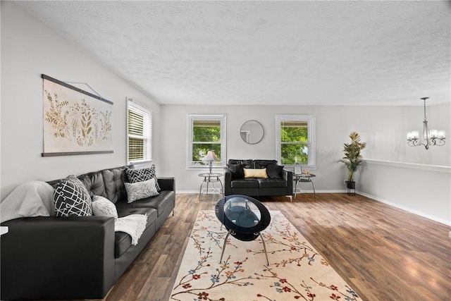 911 Copperkettle Rd, Webster, NY 14580 - living area featuring a textured ceiling, a chandelier, and wood finished floors