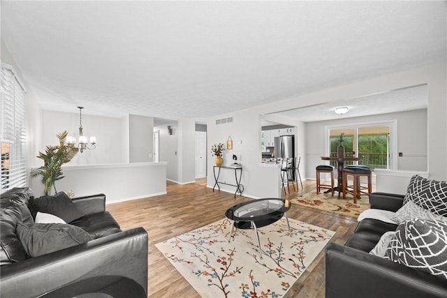 911 Copperkettle Rd, Webster, NY 14580 - living area with a chandelier and wood finished floors