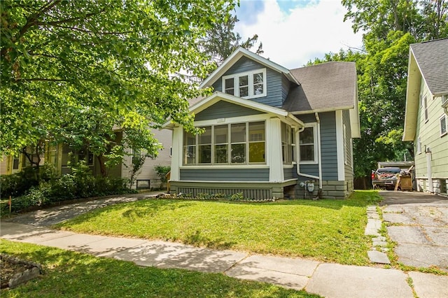 1085 Garson Ave, Rochester, NY 14609 - view of front of property featuring a front lawn and a shingled roof
