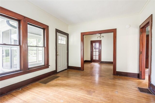 1085 Garson Ave, Rochester, NY 14609 - entryway with light wood-style flooring, plenty of natural light, and ornamental molding