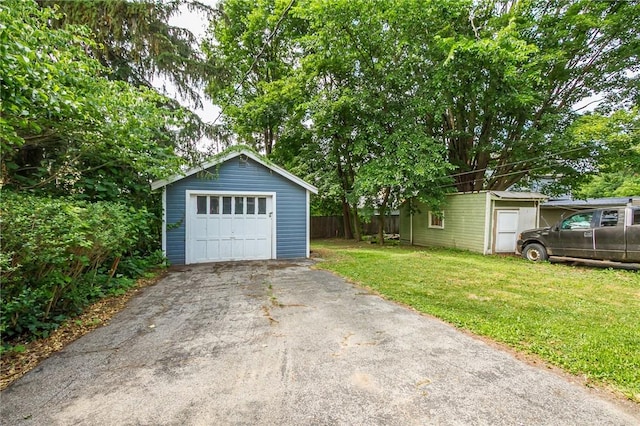 1085 Garson Ave, Rochester, NY 14609 - detached garage featuring asphalt driveway