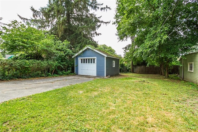 1085 Garson Ave, Rochester, NY 14609 - view of yard with an outbuilding, a garage, and asphalt driveway