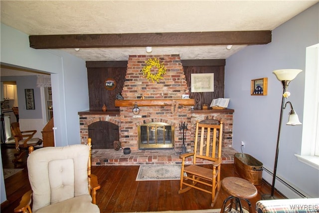 4748 Thrall Rd, Cambria, NY 14094 - living room with a fireplace, a baseboard radiator, hardwood / wood-style flooring, and beamed ceiling