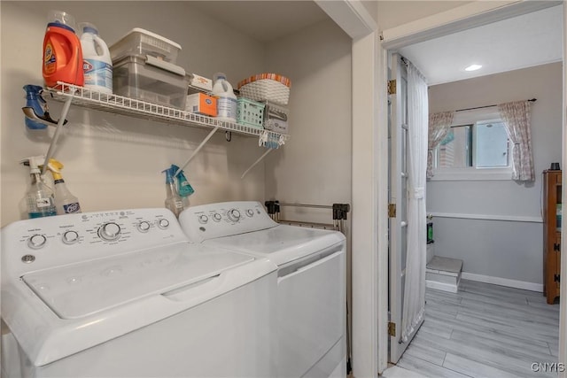 217 Melrose Ave, Camillus, NY 13219 - washroom with washing machine and dryer and light wood-style flooring