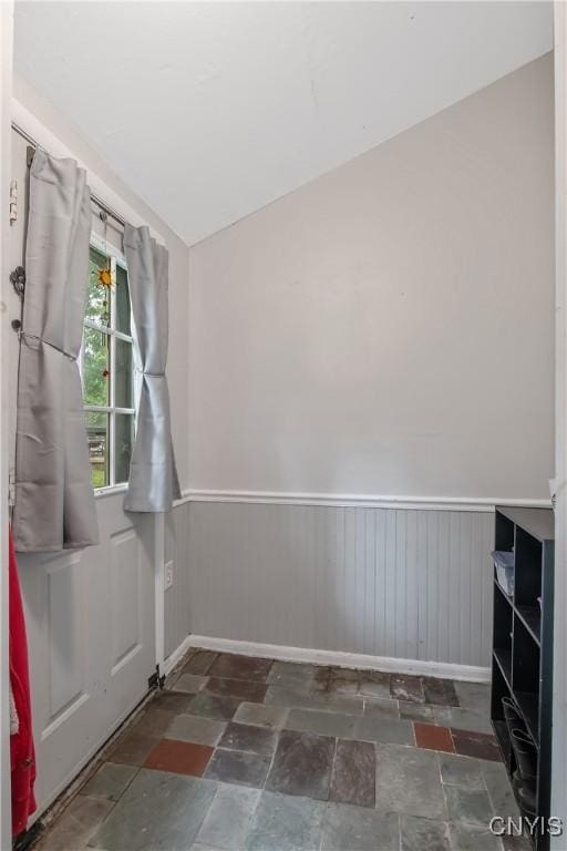 217 Melrose Ave, Camillus, NY 13219 - unfurnished room with stone finish floors and a wainscoted wall