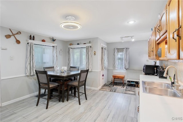 217 Melrose Ave, Camillus, NY 13219 - dining space featuring light wood-type flooring and baseboards