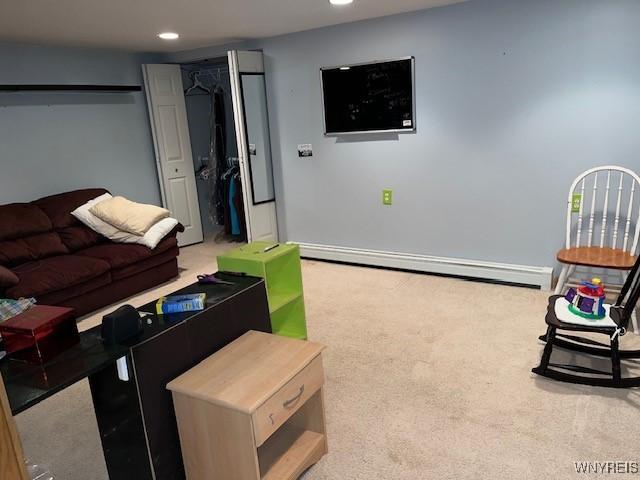 208 Angle Rd, West Seneca, NY 14224 - carpeted living room featuring a baseboard heating unit and recessed lighting