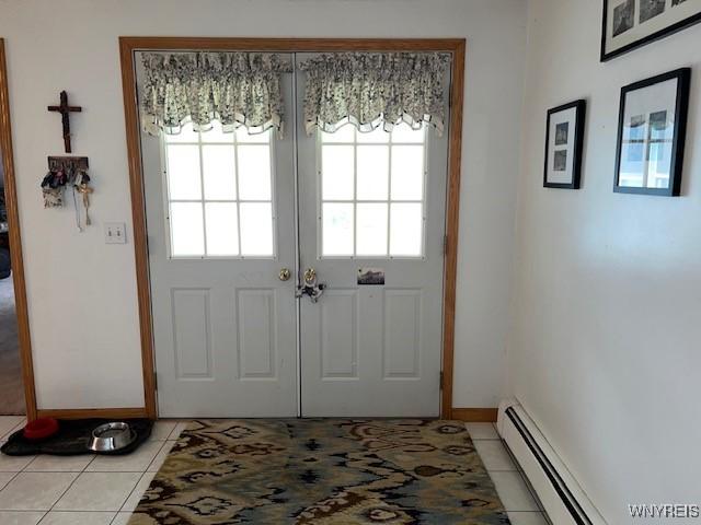 208 Angle Rd, West Seneca, NY 14224 - entryway with a baseboard heating unit and light tile patterned flooring