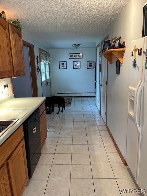 208 Angle Rd, West Seneca, NY 14224 - kitchen with white fridge with ice dispenser, black dishwasher, a baseboard heating unit, a textured ceiling, and light countertops