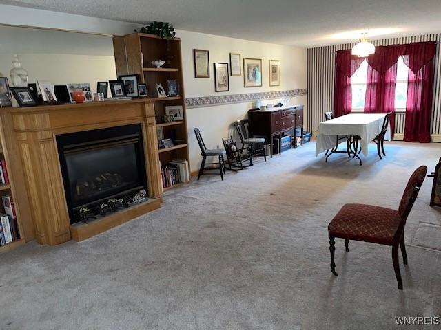 208 Angle Rd, West Seneca, NY 14224 - living room with carpet floors and a fireplace