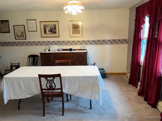 208 Angle Rd, West Seneca, NY 14224 - dining room with light colored carpet and a chandelier