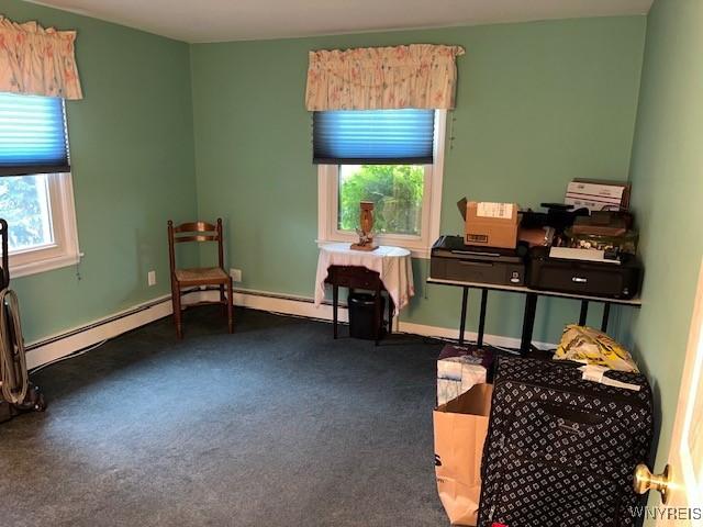 208 Angle Rd, West Seneca, NY 14224 - living area featuring carpet flooring and a baseboard radiator