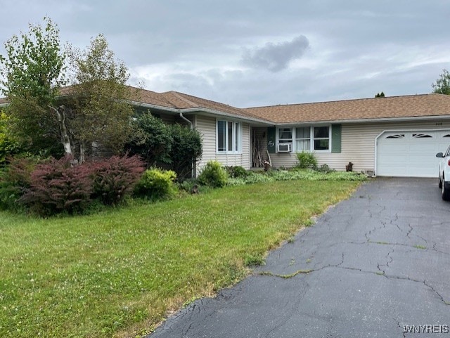 208 Angle Rd, West Seneca, NY 14224 - single story home with an attached garage, a front yard, and asphalt driveway