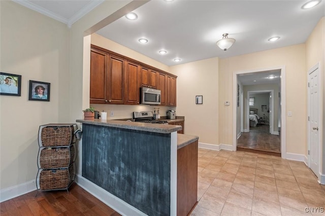 37 Augustus St, Auburn, NY 13021 - kitchen with stainless steel appliances, a peninsula, ornamental molding, recessed lighting, and brown cabinets