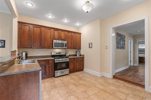 37 Augustus St, Auburn, NY 13021 - kitchen with appliances with stainless steel finishes and brown cabinetry