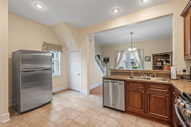 37 Augustus St, Auburn, NY 13021 - kitchen featuring appliances with stainless steel finishes, a peninsula, decorative light fixtures, recessed lighting, and a chandelier