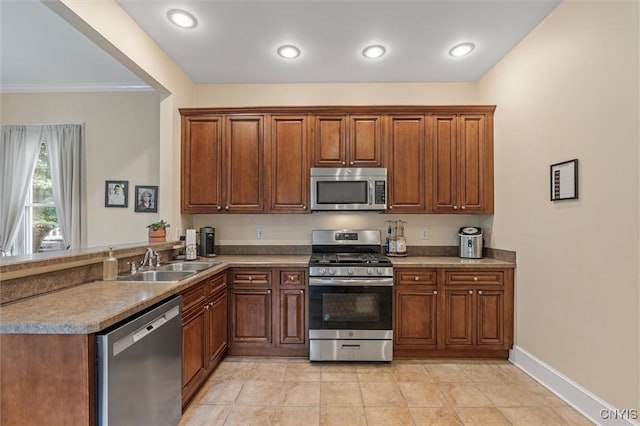 37 Augustus St, Auburn, NY 13021 - kitchen featuring stainless steel appliances, a peninsula, crown molding, light tile patterned floors, and brown cabinetry