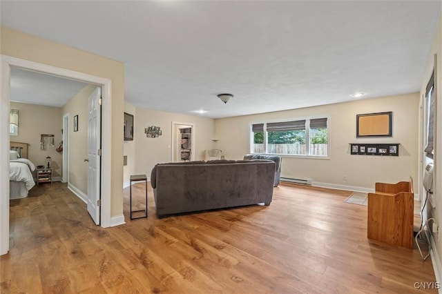 37 Augustus St, Auburn, NY 13021 - living room featuring a baseboard radiator and light wood-style floors