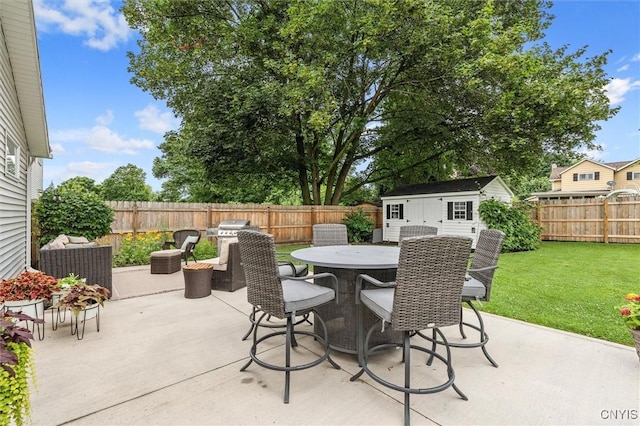 37 Augustus St, Auburn, NY 13021 - fenced backyard with a patio, outdoor dining space, and a storage unit