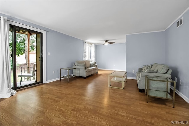 145 Charter Oaks Dr Unit 2, Amherst, NY 14228 - living area with healthy amount of natural light, wood finished floors, ornamental molding, and a ceiling fan