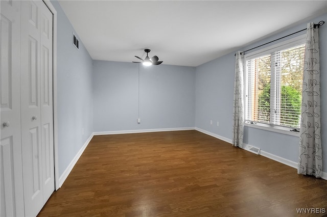 145 Charter Oaks Dr Unit 2, Amherst, NY 14228 - unfurnished bedroom featuring dark wood-style floors and ceiling fan