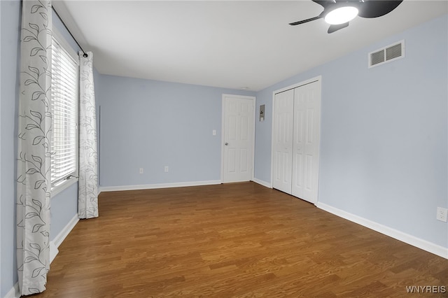 145 Charter Oaks Dr Unit 2, Amherst, NY 14228 - unfurnished bedroom featuring wood finished floors, a closet, and a ceiling fan