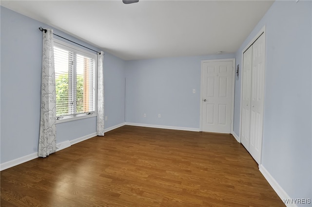 145 Charter Oaks Dr Unit 2, Amherst, NY 14228 - unfurnished bedroom featuring wood finished floors and a closet