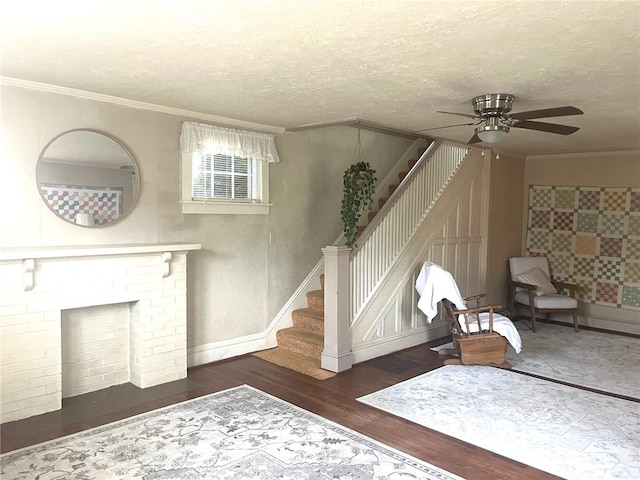 73 Platt St, Hornell, NY 14843 - living room with stairs, wood finished floors, ornamental molding, a ceiling fan, and a textured ceiling