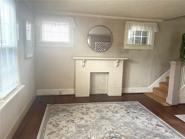 73 Platt St, Hornell, NY 14843 - unfurnished living room with wood finished floors, crown molding, and stairway