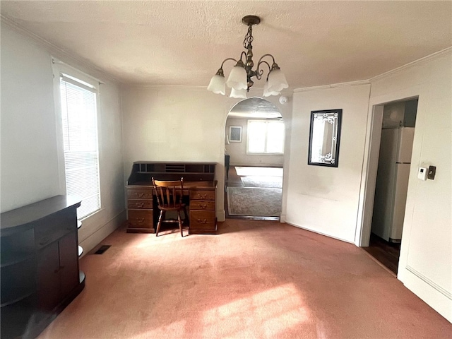 73 Platt St, Hornell, NY 14843 - dining room featuring ornamental molding, arched walkways, a chandelier, carpet floors, and healthy amount of natural light