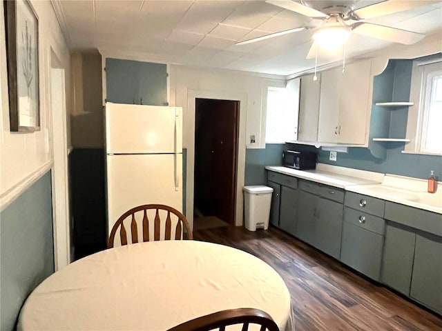73 Platt St, Hornell, NY 14843 - kitchen with freestanding refrigerator, black microwave, gray cabinets, open shelves, and dark wood finished floors