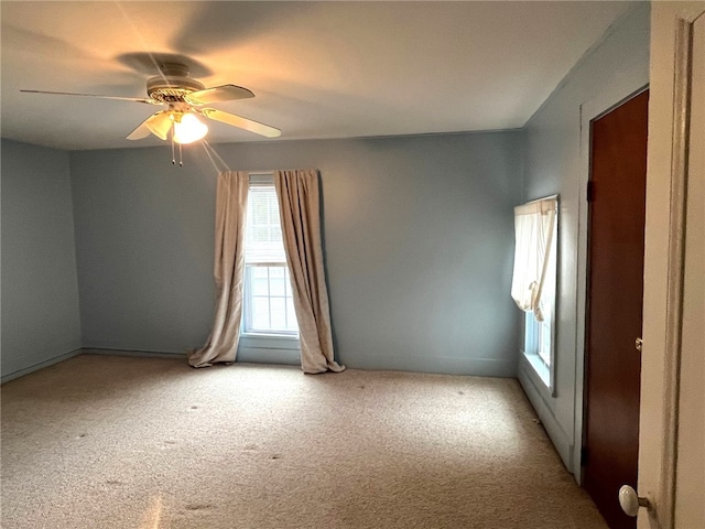 73 Platt St, Hornell, NY 14843 - unfurnished room featuring healthy amount of natural light, ceiling fan, and light colored carpet