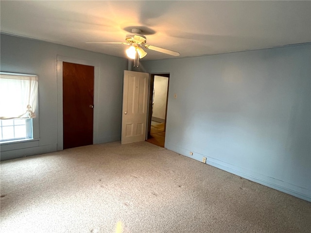 73 Platt St, Hornell, NY 14843 - unfurnished bedroom featuring carpet floors and ceiling fan