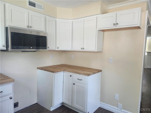 127 Austin Ave, Syracuse, NY 13207 - kitchen featuring stainless steel microwave, white cabinetry, and dark wood-style floors