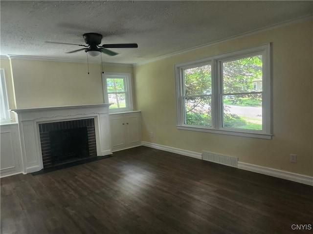 127 Austin Ave, Syracuse, NY 13207 - unfurnished living room featuring ornamental molding, dark wood-style floors, a textured ceiling, a fireplace, and a ceiling fan