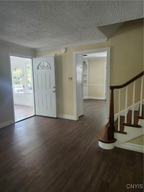 127 Austin Ave, Syracuse, NY 13207 - foyer entrance with a textured ceiling, dark wood-style floors, and stairway