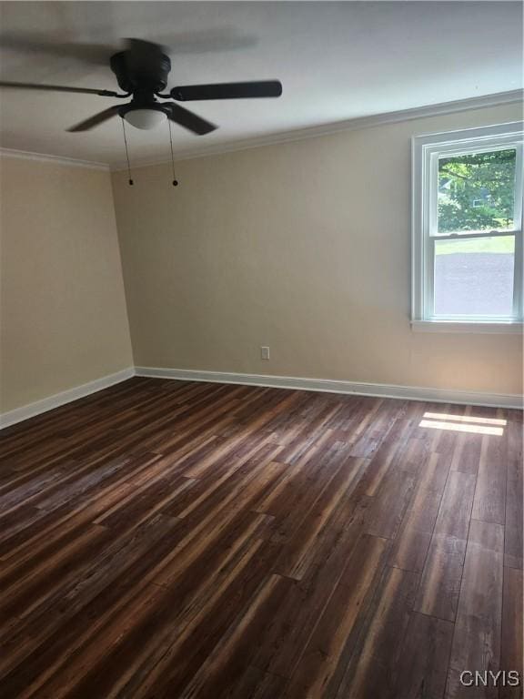 127 Austin Ave, Syracuse, NY 13207 - spare room featuring dark wood finished floors, ornamental molding, and a ceiling fan