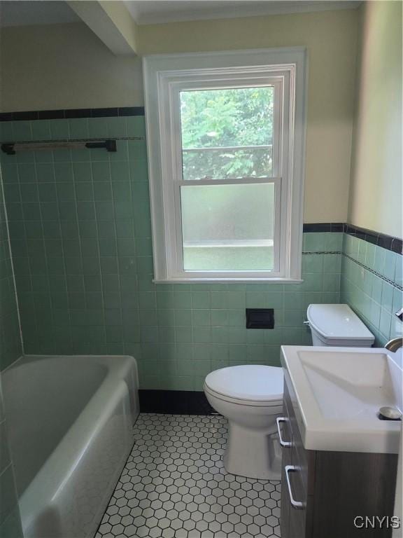 127 Austin Ave, Syracuse, NY 13207 - bathroom featuring tile walls, tile patterned flooring, vanity, and a wainscoted wall