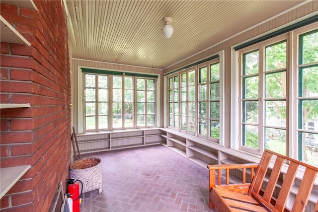 27 E Main St, Sodus, NY 14551 - unfurnished sunroom with brick flooring and wooden walls