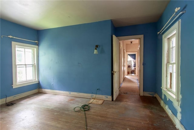 27 E Main St, Sodus, NY 14551 - unfurnished room with wood finished floors and baseboards