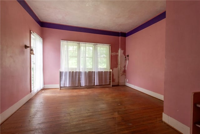 27 E Main St, Sodus, NY 14551 - unfurnished room featuring wood finished floors and crown molding