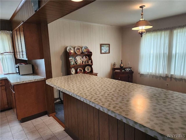 123 Roseland Ave, Ridgeway, NY 14103 - kitchen featuring light tile patterned flooring, light countertops, and hanging light fixtures
