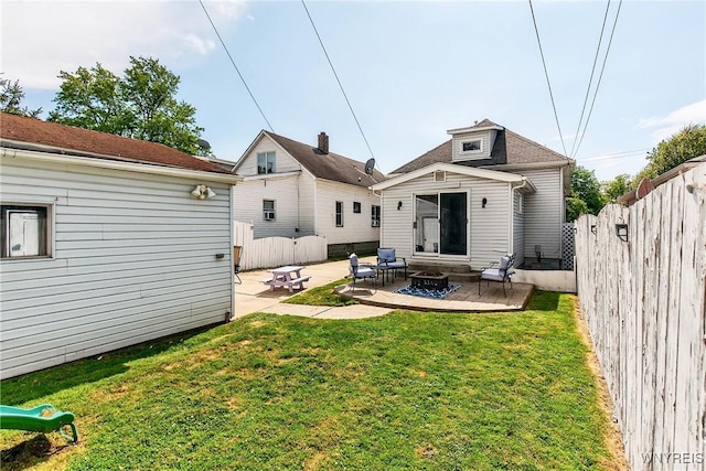 101 Barnsdale Ave, West Seneca, NY 14224 - rear view of house with an outdoor fire pit, a patio area, and an outbuilding