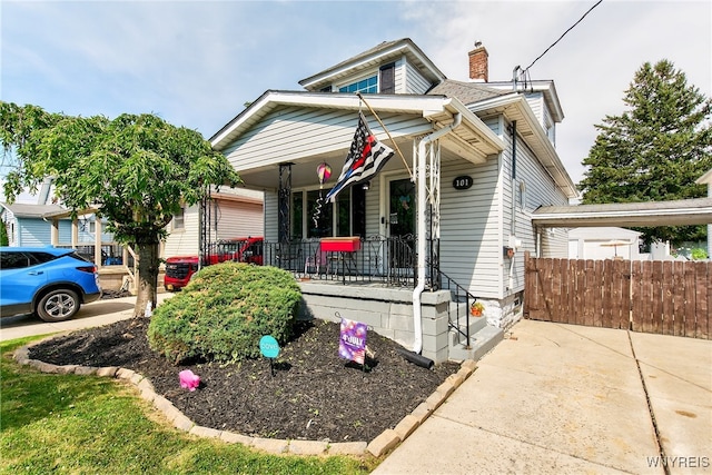 101 Barnsdale Ave, West Seneca, NY 14224 - view of front of house featuring covered porch and a chimney