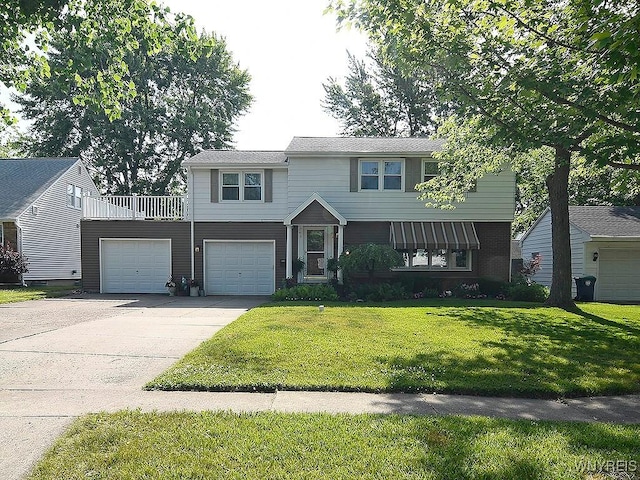 149 Ava Ln, Amherst, NY 14221 - view of front of house featuring driveway, a front yard, and a garage