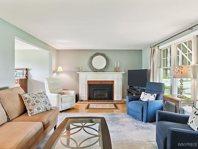 149 Ava Ln, Amherst, NY 14221 - living room featuring wood finished floors and a brick fireplace