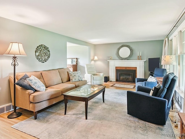 149 Ava Ln, Amherst, NY 14221 - living room featuring wood finished floors and a brick fireplace