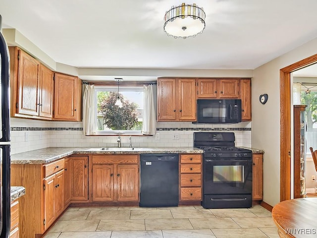 149 Ava Ln, Amherst, NY 14221 - kitchen with black appliances, tasteful backsplash, healthy amount of natural light, and brown cabinets