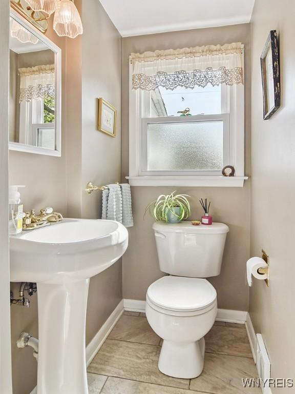 149 Ava Ln, Amherst, NY 14221 - half bathroom featuring baseboards and baseboard heating